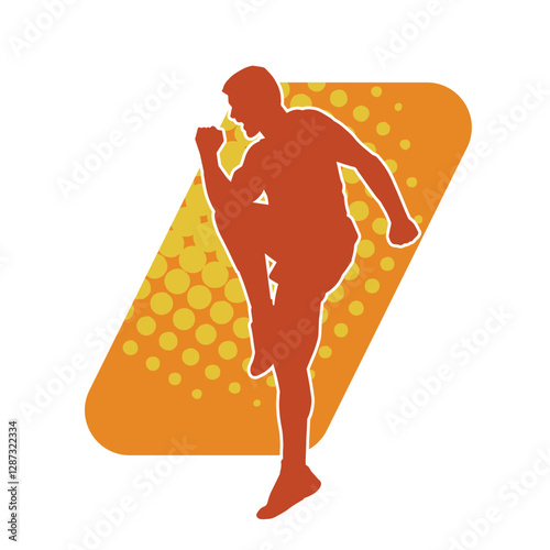 Silhouette of a sporty male in action pose at the gym. Silhouette of a slim man in aerobics workout pose.