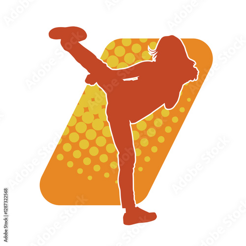 Silhouette of a slim female doing martial art pose. Silhouette of a martial art woman in action pose.