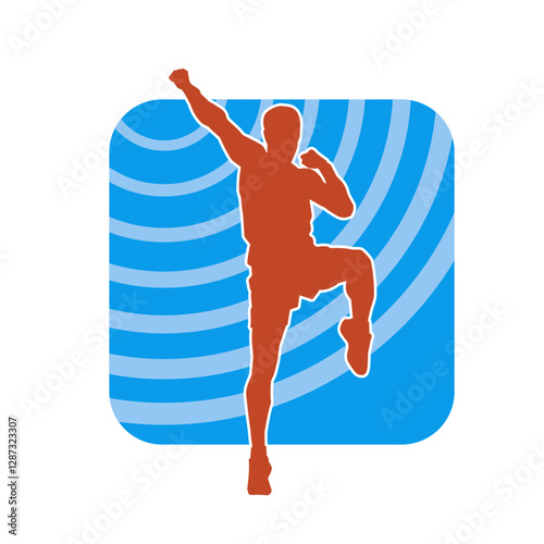 Silhouette of a sporty male in action pose at the gym. Silhouette of a slim man in aerobics workout pose.