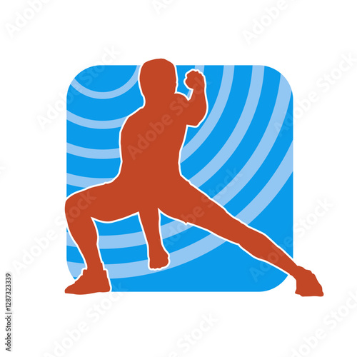 Silhouette of a sporty male in action pose at the gym. Silhouette of a slim man in aerobics workout pose.