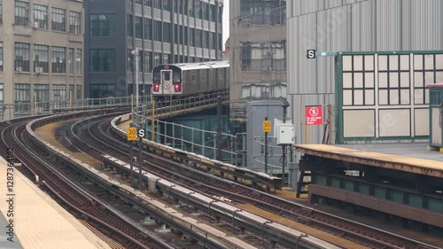 New York subway station. Metro train on metropolitan platform, United States public transportation. Elevated outdoor Court Square railway line, Queens. NYC passenger railroad traffic, Long Island City