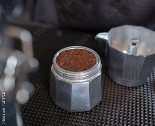 Espresso in Moka pot coffee on table.