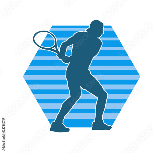 Silhouette of a male tennis player in action pose. Silhouette of a man playing tennis sport with racket.
