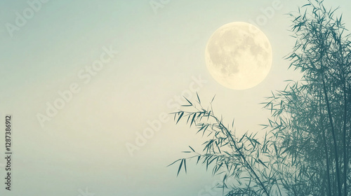 Mystical full moon rising behind silhouetted bamboo in teal night sky
Mystical full moon rising behind silhouetted bamboo in teal night sky