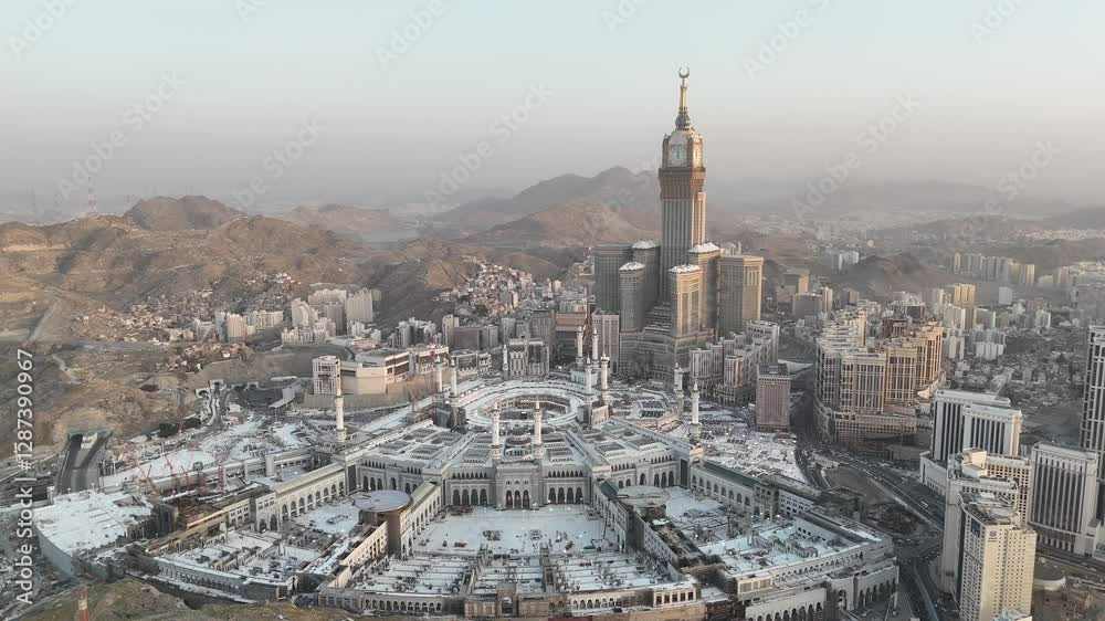 Mecca , Saudi Arabia Mars 30 2024: Makkah city Streets hotels and transportation Makkah Clock Tower - Masjid Al Haram 4k drone Video - aerial view