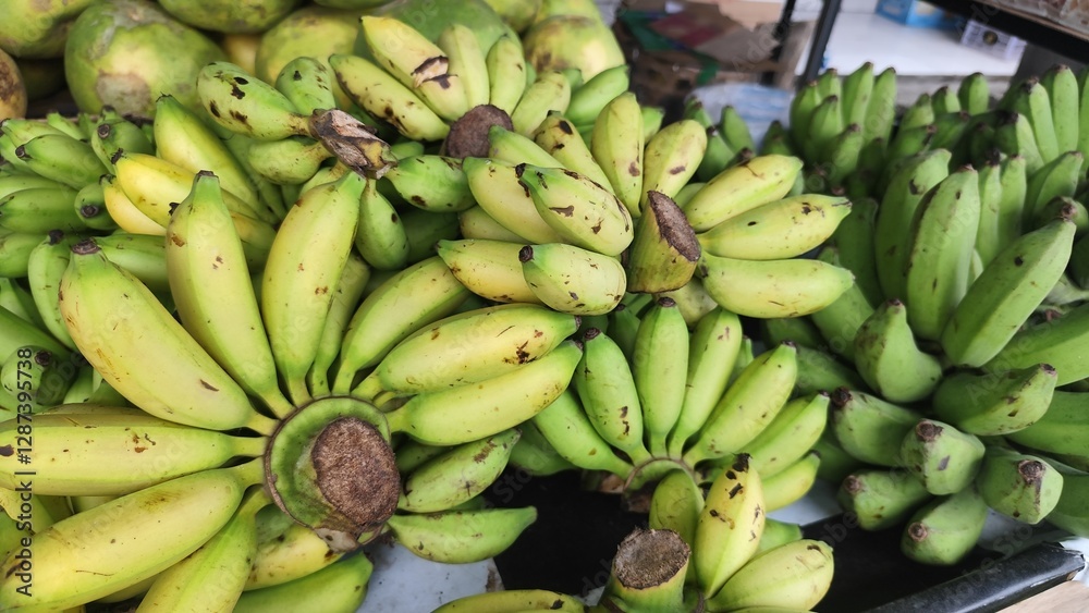 Ripe and half-ripe bananas displayed in supermarket display cases Ripe and half-ripe bananas displayed in supermarket display cases