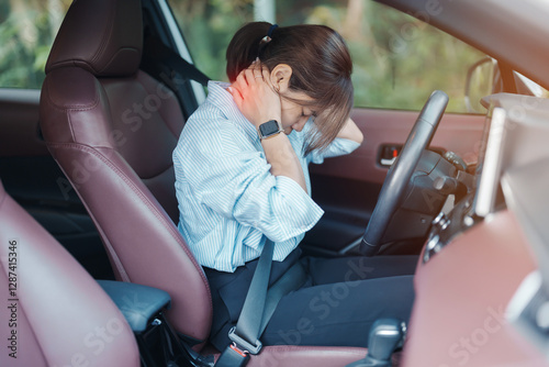 woman with her shoulder and neck sprain while driving car long time, muscle painful. Shoulder ache, Scapular pain, office syndrome and ergonomic concept
