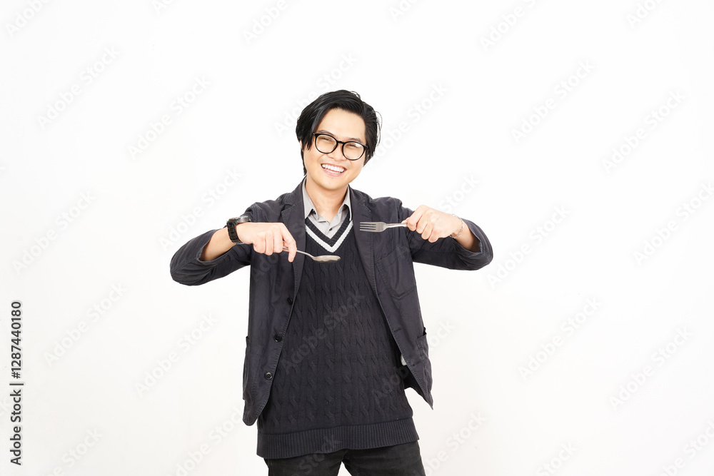 Happy gesture with holding fork and spoon Of Handsome Asian Man Isolated On White Background Happy gesture with holding fork and spoon Of Handsome Asian Man Isolated On White Background