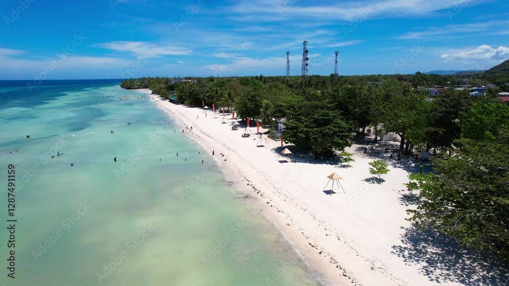 Aerial view of Quinale Beach in Anda, Bohol, Philippines during a perfect sunny day.