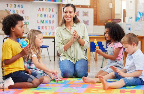 Foto Teacher, kids and teaching music in classroom for creative learning, language development and support