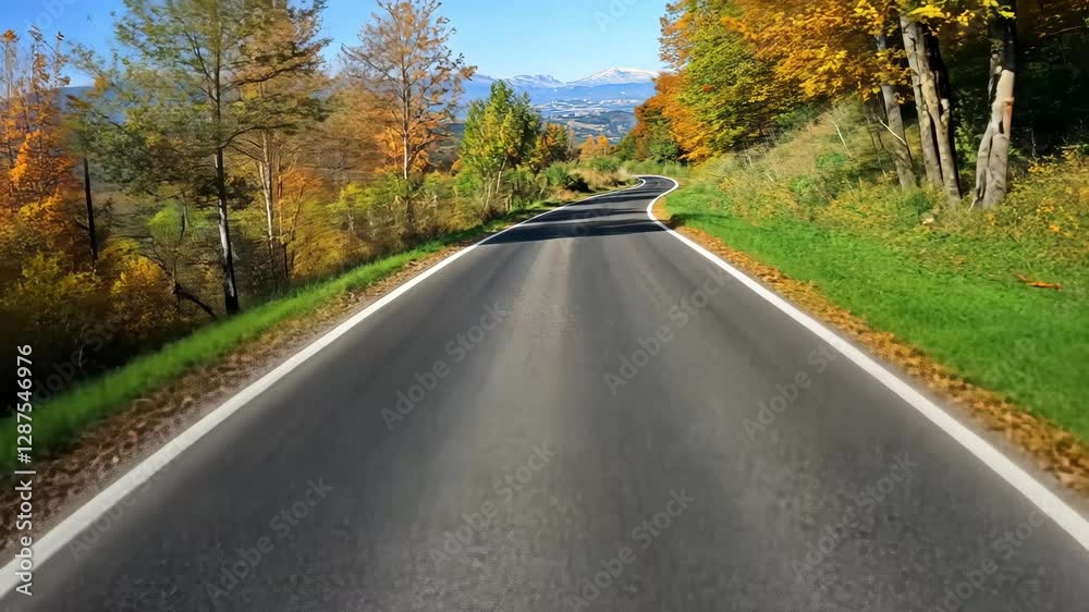 Serene autumn road winding through vibrant foliage with mountains in the background under a clear blue sky Serene autumn road winding through vibrant foliage with mountains in the background under a clear blue sky