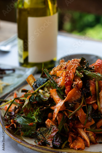 raw gizzard shad salad seasoned with spicy sauce and vegetables photo