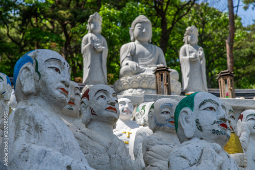 various Buddha statues in the Buddhist temple photo