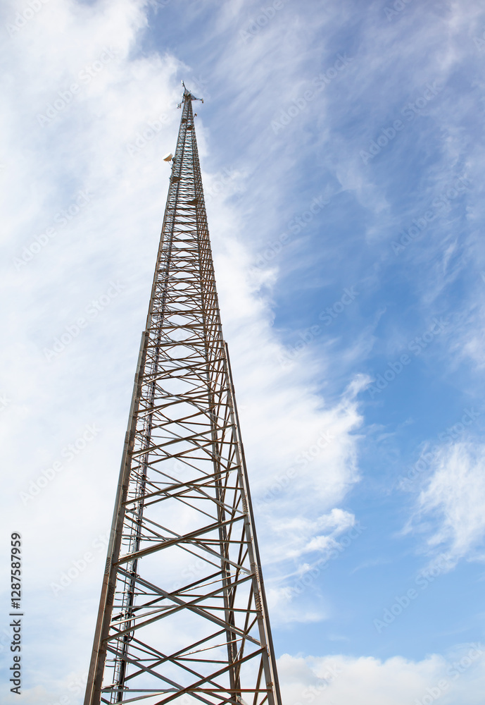 Antenna tower of telecommunication and Phone base station with TV and wireless internet antennas Antenna tower of telecommunication and Phone base station with TV and wireless internet antennas