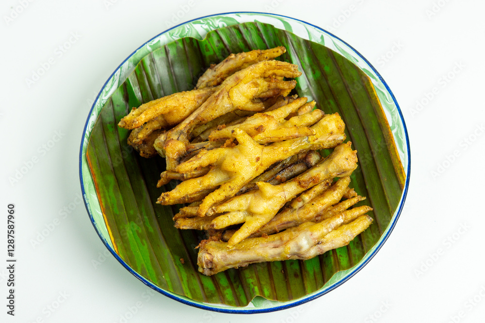 Fried chicken feet (Indonesian called ceker or cakar) with white background Fried chicken feet (Indonesian called ceker or cakar) with white background