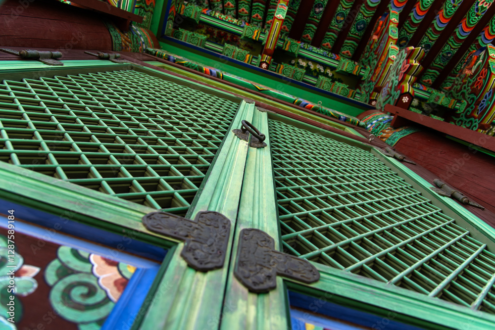 Low-angle view of the wooden door and column in the buddhist temple building