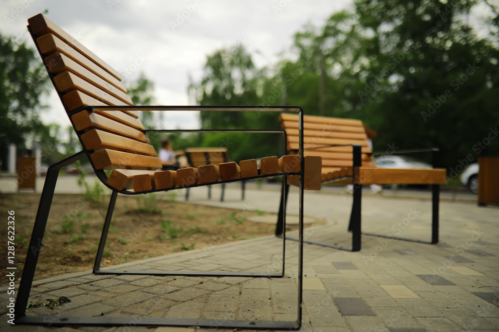 Bench in a park on a sunny autumn morning. Morning walk. Bench in a park on a sunny autumn morning. Morning walk.