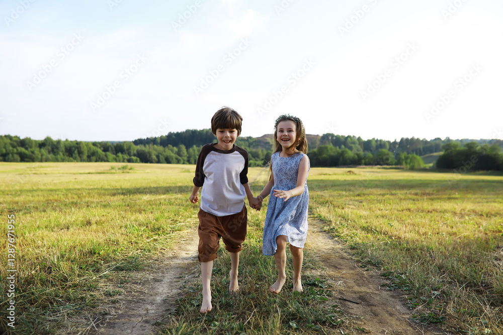 Children walk in the summer in nature. Child on a sunny spring morning in the park. Traveling with children. Children walk in the summer in nature. Child on a sunny spring morning in the park. Traveling with children.