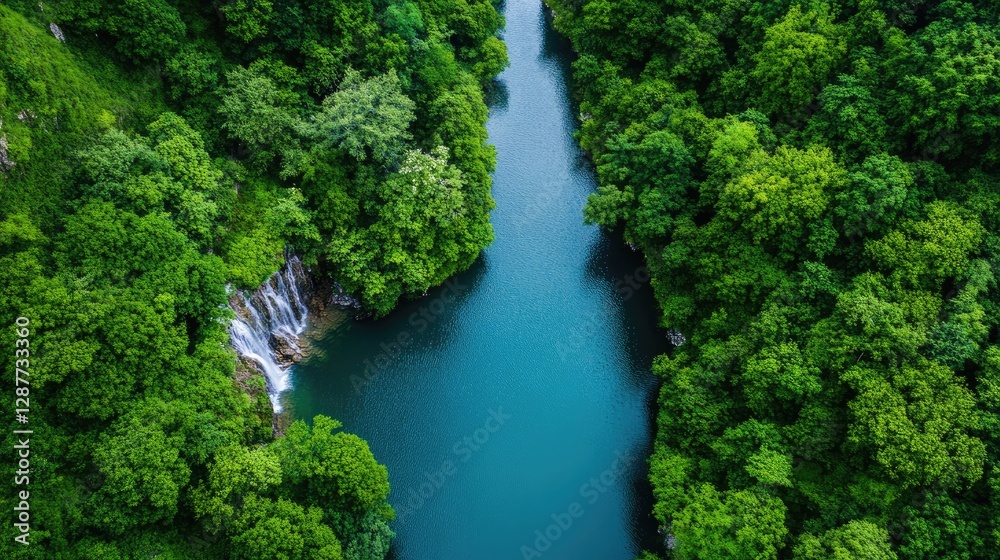 Serene Aerial View of Lush Green Forest and Tranquil Waterfall Serene Aerial View of Lush Green Forest and Tranquil Waterfall