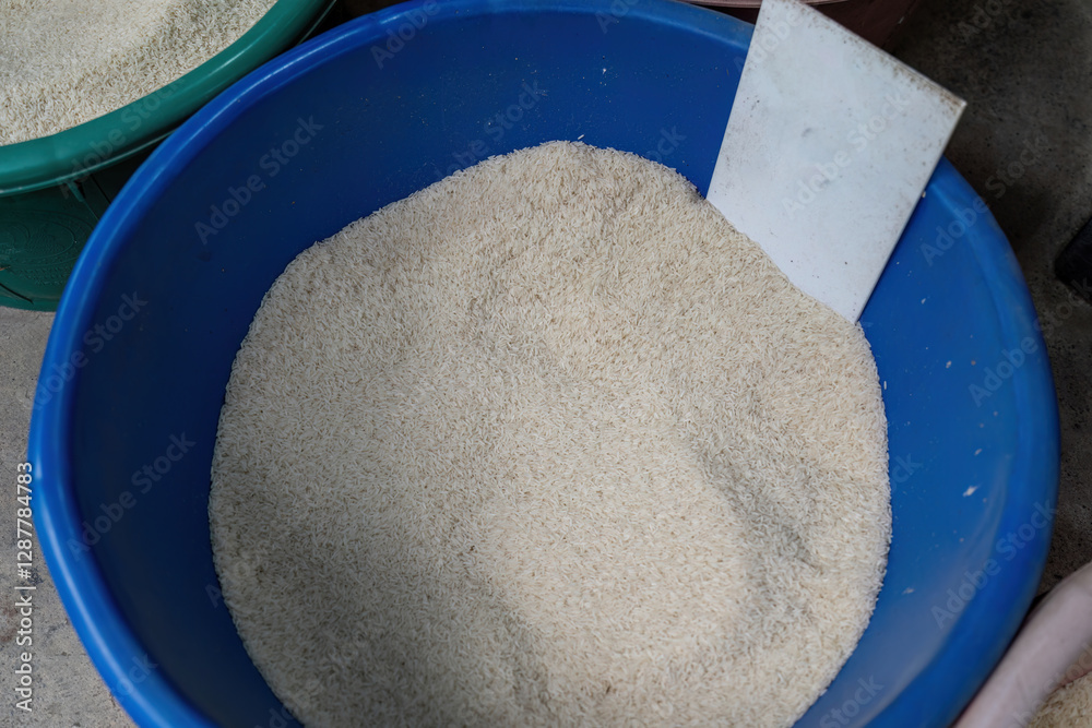 A bucket of long grain rice at a local thai market
A bucket of long grain rice at a local thai market