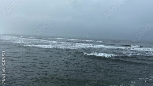 Cloudy weather on the ocean coast. Gloomy ocean coast. Dramatic sky over the ocean. Dramatic ocean coast.