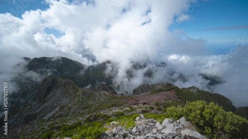 Hikers walking to Pico Ruivo, rolling clouds through mountains, time lapse, Madeira Island, Portugal