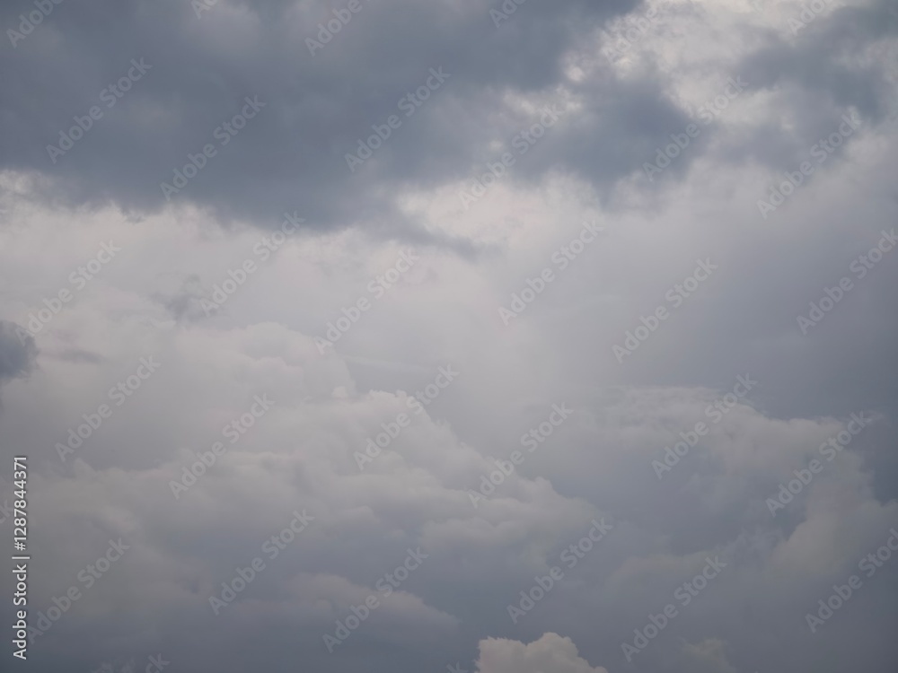 A sky veiled in heavy, brooding clouds, promising an impending downpour. A sky veiled in heavy, brooding clouds, promising an impending downpour.