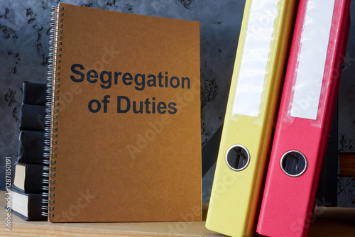 Book titled Segregation of Duties on shelf. Corporate governance and risk management.