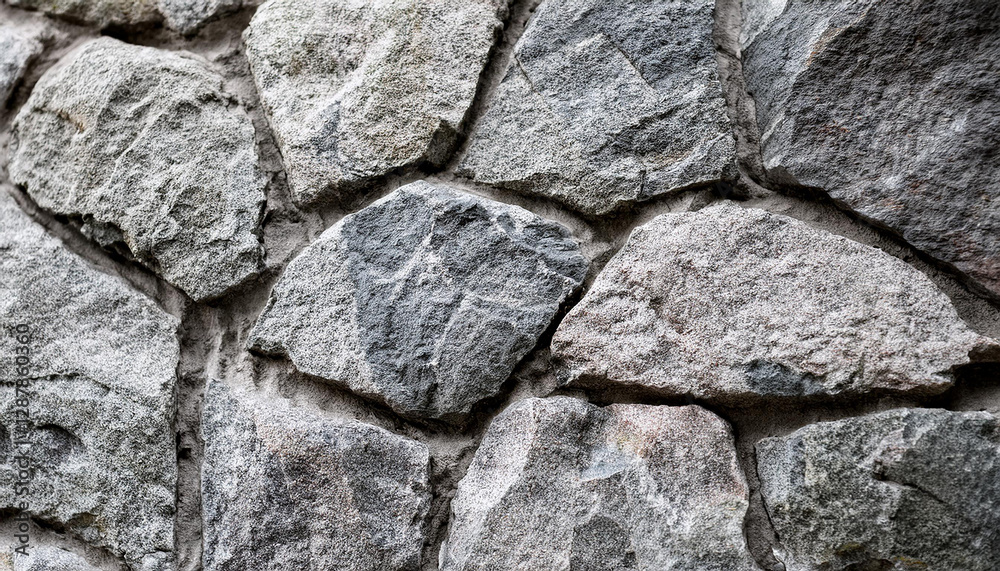 Abstract gray grunge background. Textured stone wall. Close-up. Abstract gray grunge background. Textured stone wall. Close-up.