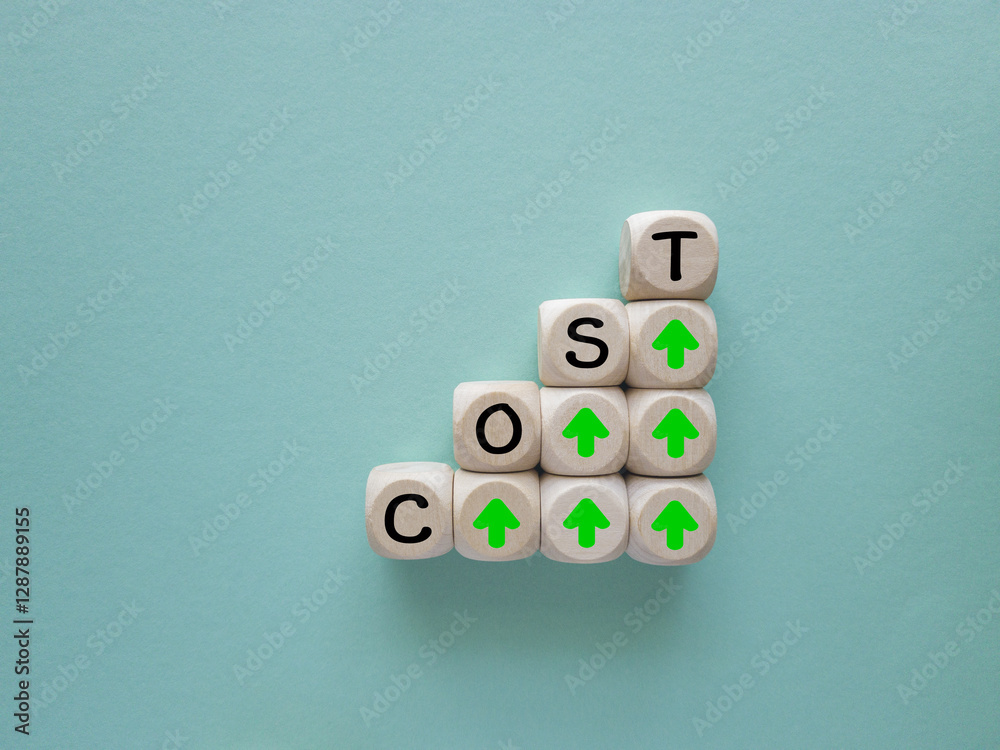 Stacking of cost wording on the top of wooden block cube with up arrow for cost of product and manufacturing increase concept. Blue background.
