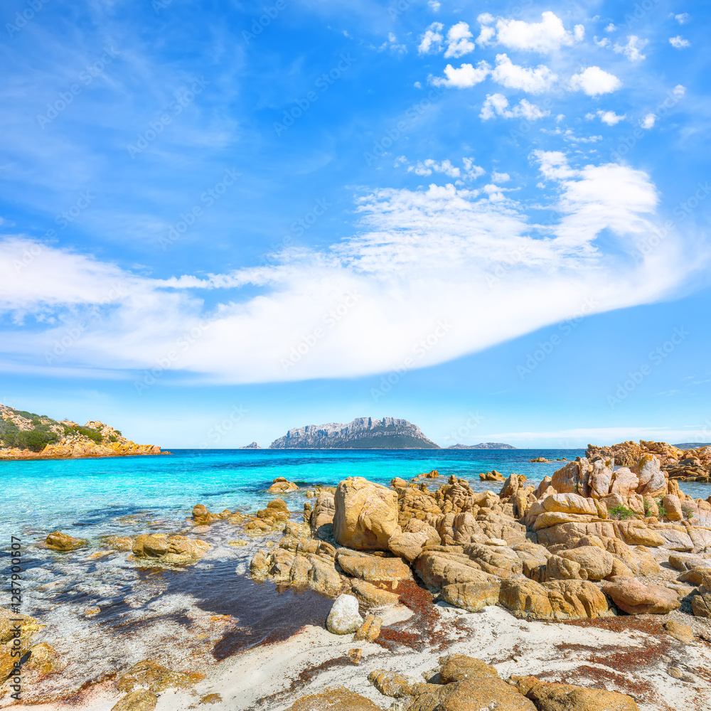 Superb azure water with rocks near beach Porto Taverna.