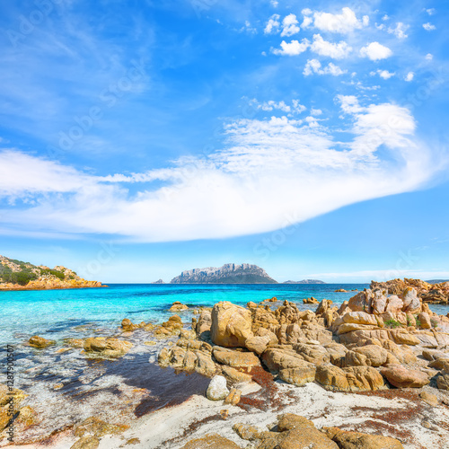 Superb azure water with rocks near beach Porto Taverna.