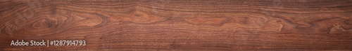 Walnut wood texture. Extra long walnut wood plank natural texture background. Long wood plank texture.