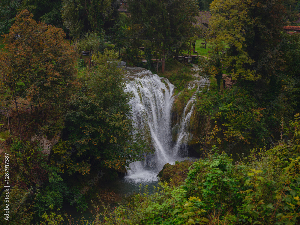 Fototapeta premium Travel to Village of Rastoke near Slunj in Croatia. Breathtaking view old water mills on waterfalls of Korana river, beautiful countryside landscape