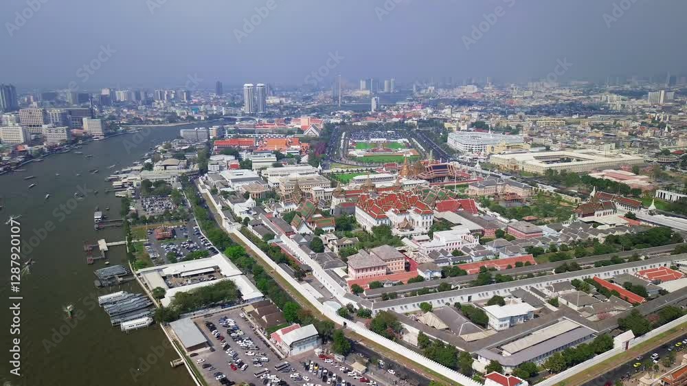 Aerial establishing overview of the Grand Palace in Bangkok, Thailand, golden rooftops, intricate temples, and courtyards Aerial establishing overview of the Grand Palace in Bangkok, Thailand, golden rooftops, intricate temples, and courtyards