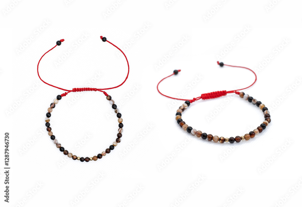Two Bracelets on Red Cord with Shamballa Knot, Agates, and Tiger's Eye on White Background