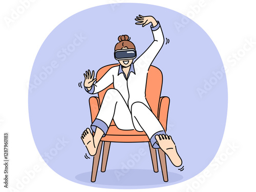 Woman wearing vr headset sits in chair and waves arms and legs, feeling euphoria of being immersed in virtual reality. Girl in pajamas uses vr glasses to travel through metaverse and play video games.