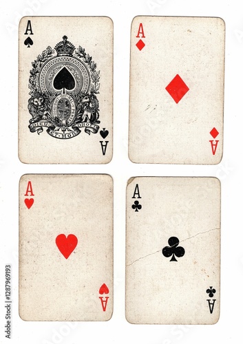 A hand of vintage playing cards showing four of the same value on a white background. photo