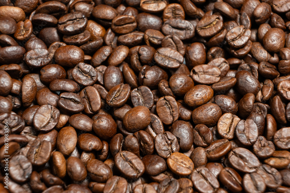 Scattered coffee beans top down macro shot Scattered coffee beans top down macro shot
