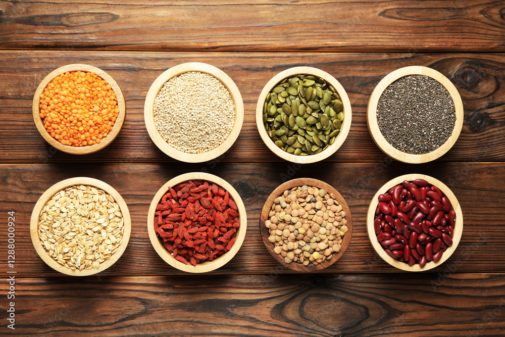 Different superfood products on wooden table, flat lay Different superfood products on wooden table, flat lay