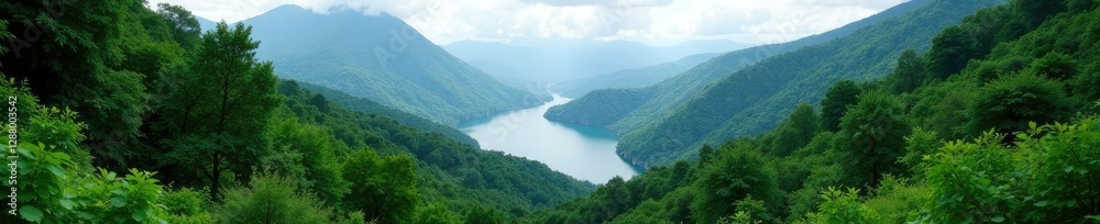 Dense foliage covering the mountainous region with a serene lake in the distance, wilderness, forestry Dense foliage covering the mountainous region with a serene lake in the distance, wilderness, forestry