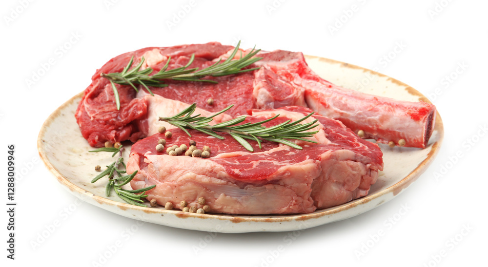 Pieces of raw beef meat and spices isolated on white Pieces of raw beef meat and spices isolated on white