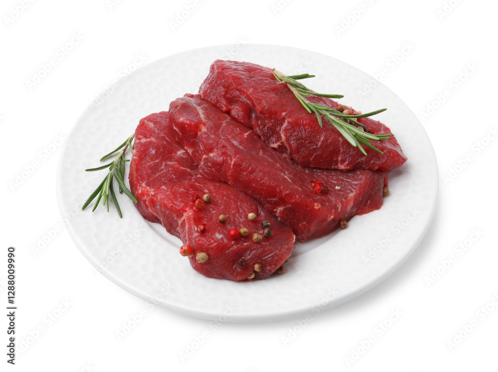 Pieces of raw beef meat and spices isolated on white Pieces of raw beef meat and spices isolated on white