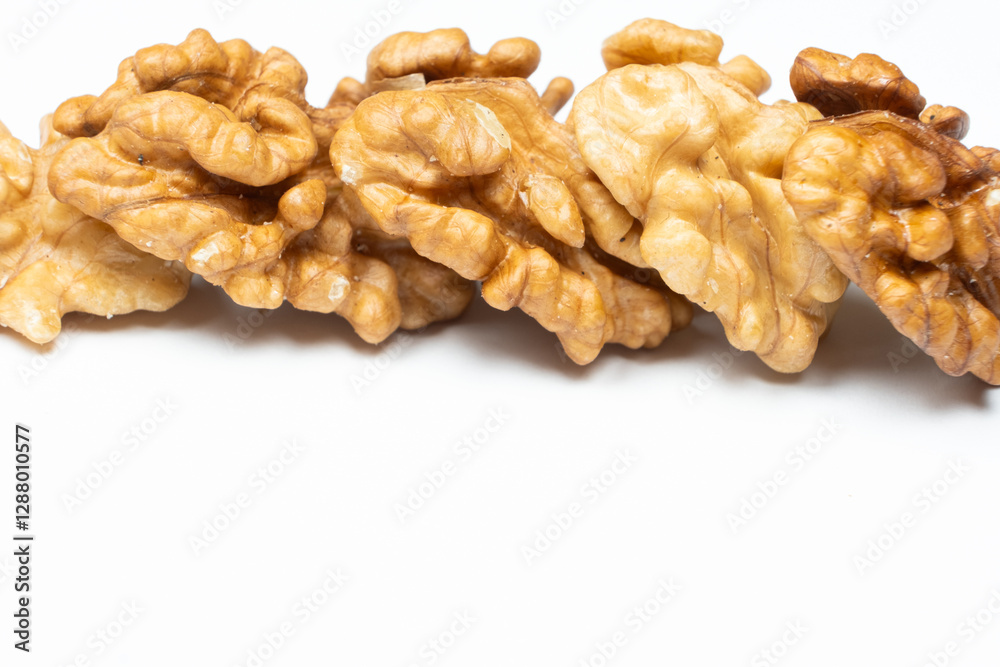 Shelled walnuts on a white background close-up Shelled walnuts on a white background close-up