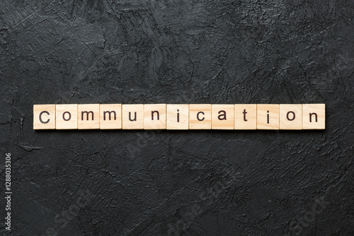 COMMUNICATION word written on wood block. COMMUNICATION text on cement table for your desing, concept