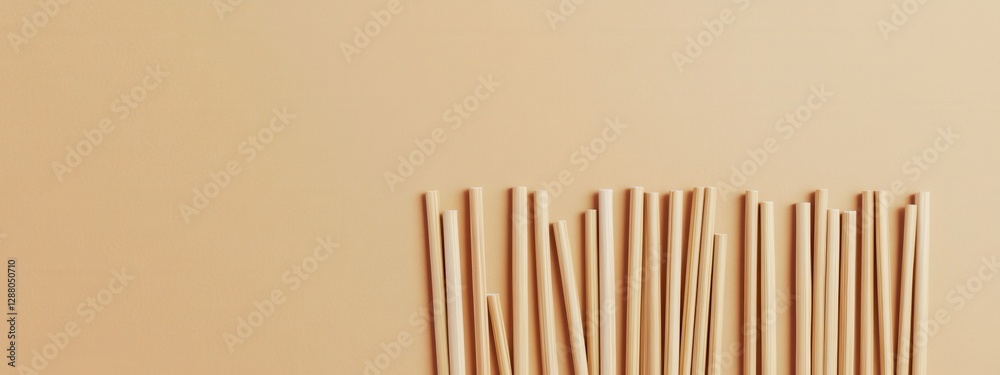 Brown wooden sticks arranged on a beige background showcasing natural textures and simple design elements Brown wooden sticks arranged on a beige background showcasing natural textures and simple design elements