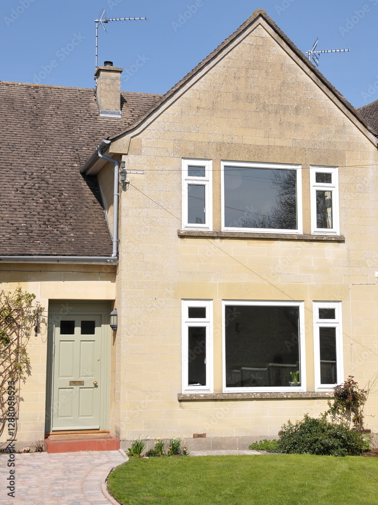 Exterior view of a beautiful house and garden on a street in an English town Exterior view of a beautiful house and garden on a street in an English town