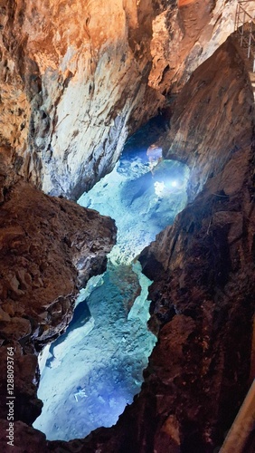 Stunning interior of Las Grutas de las Maravillas with stalactites, stalagmites, and lakes.