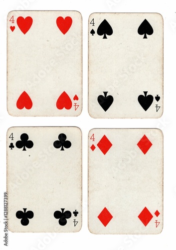 Photography A hand of vintage playing cards showing four of the same value on a white background