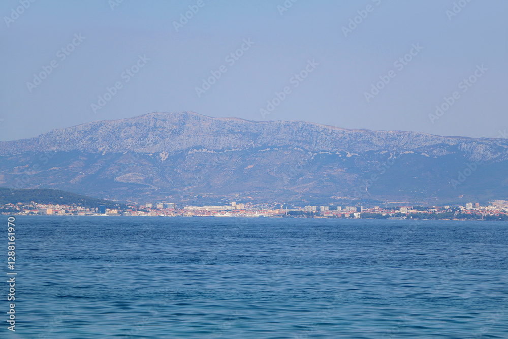 Contemporary buildings, gardens and beaches at the waterfront in Split, Croatia. View of Split from the boat. Contemporary buildings, gardens and beaches at the waterfront in Split, Croatia. View of Split from the boat.